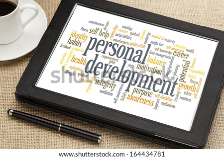 cloud of words or tags related to personal development on a  digital tablet