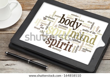 mind, body, spirit and soul - word cloud on a  digital tablet