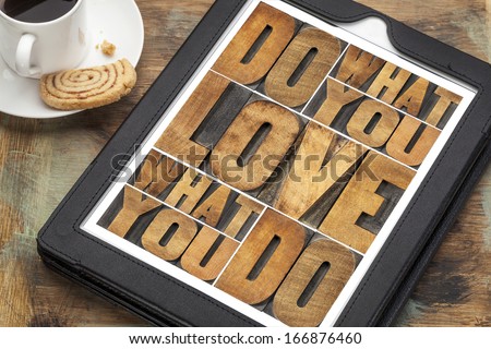 do what you love, love what you do - motivational word abstract in vintage letterpress wood type on a digital tablet