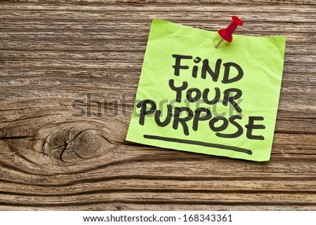 find your purpose  - motivational reminder - handwriting on sticky note against grained wood