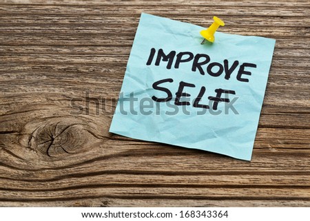 improve self motivational reminder on a sticky note against grained wood