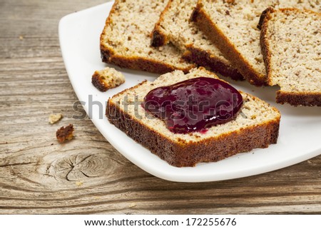 healthy breakfast concept - slices of freshly baked, gluten free bread made with almond and coconut flour and flaxseed meal, with home made, sugar free, cranberry sauce