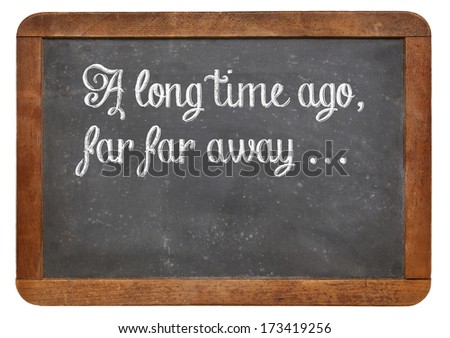 A long time ago, far, far away - a phrase for opening oral narratives, story or fairytale on a vintage blackboard, copy space below