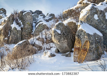 winter landscape with  sandstone rocks and classic Bear Paw snowshoes