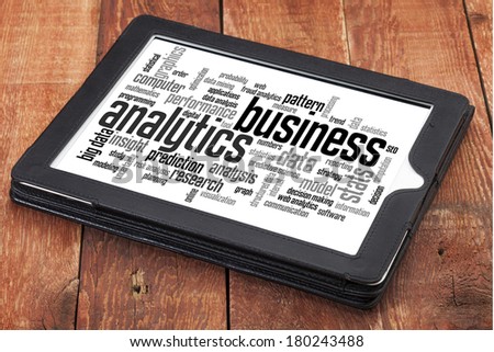 business analytics word cloud - a digital tablet on a rustic wooden table