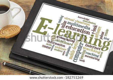 online education concept - e-learning word cloud on a digital tablet with a cup of coffee