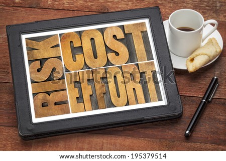 cost, effort, risk - business concept - a word abstract  in vintage wood letterpress printing blocks on a digital tablet with cup of coffee