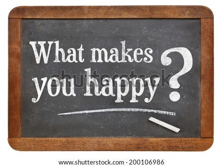 what makes you happy question on a vintage slate blackboard, isolated on white