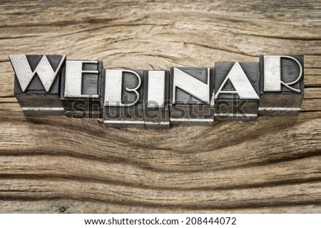 webinar word (web seminar) in letterpress metal type printing blocks against weathered grained wood