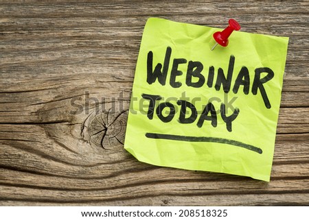 webinar today reminder - handwriting on a green sticky note against grained and knotted wood board