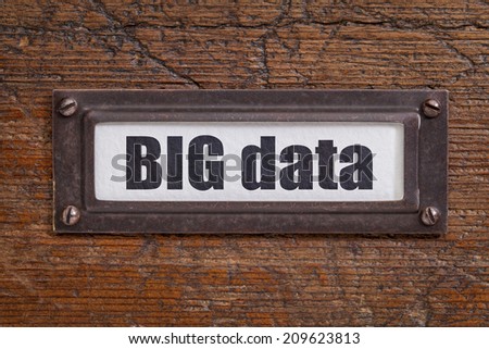 big data tag - file cabinet label, bronze holder against grunge and scratched wood -internet publishing concept