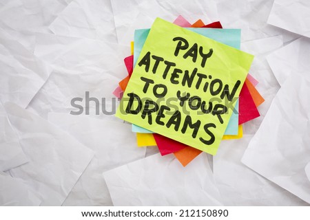 pay attention to your dreams  - reminder or advice handwritten on a colorful sticky note