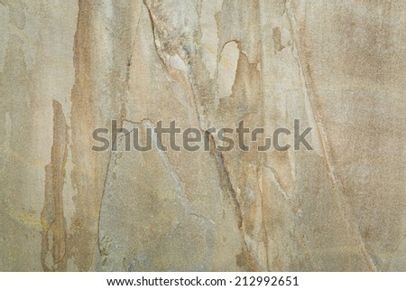 texture background of a flat yellow and gray slate rock tile