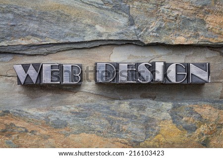 web design words in letterpress metal type against slate rock background