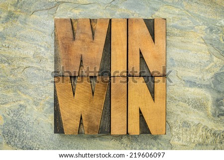 win-win - negotiation or conflict resolution strategy  -  words in letterpress wood type against slate rock background