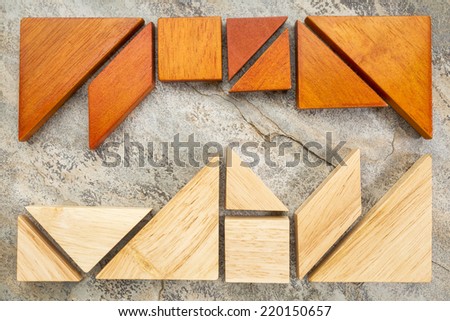 two sets of tangram puzzle on a slate rock background,  a traditional Chinese puzzle game - a competition or confrontation concept