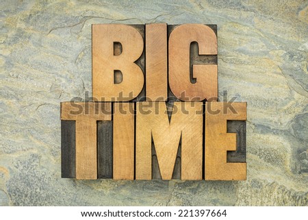 big time - text in vintage letterpress wood type on a green slate rock background