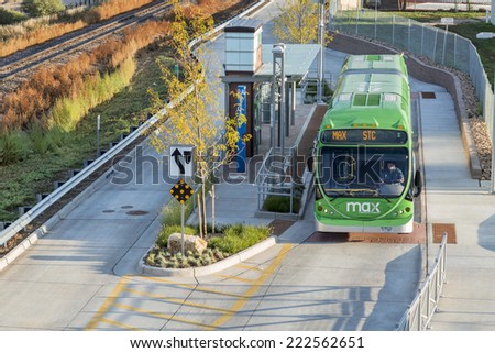 FORT COLLINS, CO, USA - SEPTEMBER 16 2014:  MAX bus at stop. MAX Bus Rapid Transit serves major activity and employment centers throughout Fort Collins including Midtown, CSU and Downtown