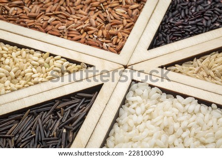 rice grain variety  - triangle abstract in a wooden tray