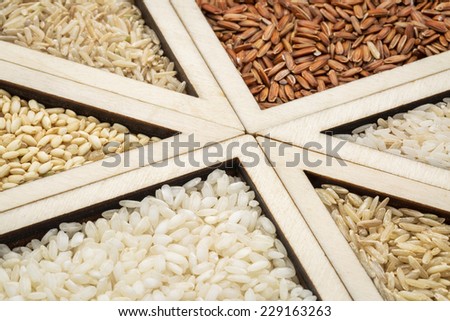 rice grain variety  - triangle abstract in a wooden tray