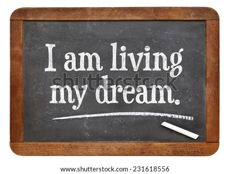 I am living my dream - positive affirmation words on a vintage slate blackboard