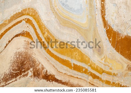 flat, orange, yellow and gray slate stone with abstract wave pattern