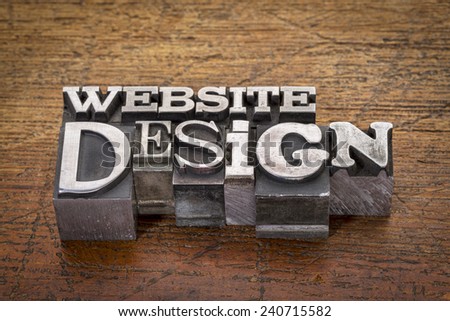 website design text in mixed vintage metal type printing blocks over grunge wood