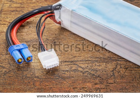 Lithium-ion polymer rechargeable battery (abbreviated as LiPo, LIP, Li-poly) with balancing and main power plugs. LiPo batteries are used in portable electronics, drones and radio controlled models.