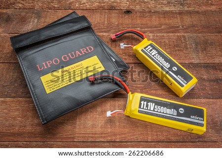 Fort Collins, CO, USA - March 18, 2015:  LiPo (lithium polymer) batteries used in drones and RC model with protective charging bags.