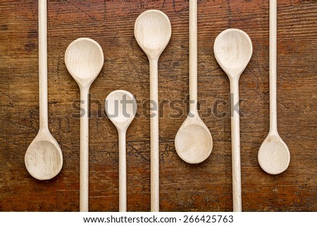 set of wooden spoons against grunge rustic wood