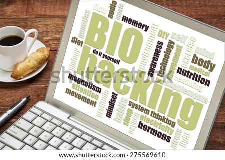 biohacking -  managing one\'s own biology using a combination of medical, nutritional and electronic techniques - word cloud on a digtal tablet