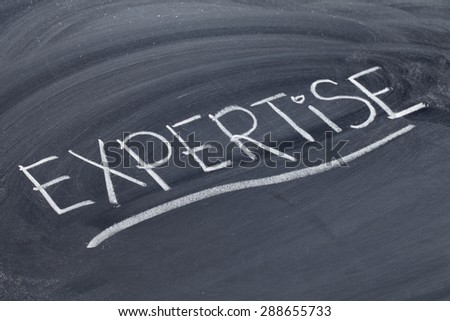 expertise word in white chalk handwriting on blackboard