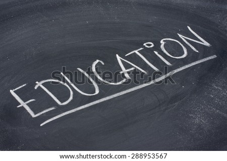 education, word in white chalk handwriting on blackboard