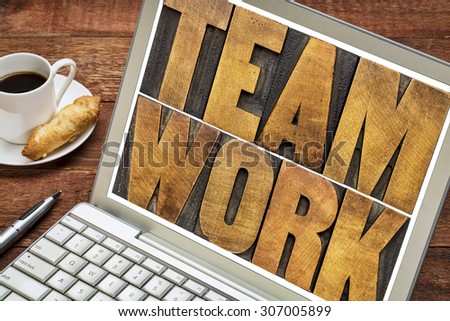 teamwork word typography - letterpress wood type printing blocks on a laptop screen with a cup of coffee