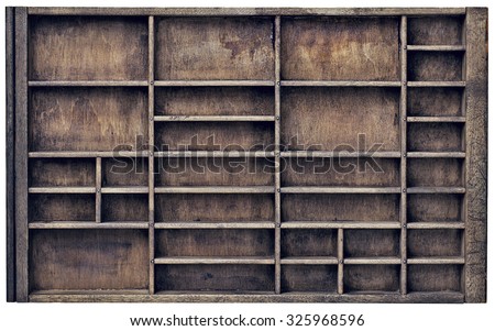 vintage wood  printer  (typesetter) drawer with numerous dividers, isolated on white