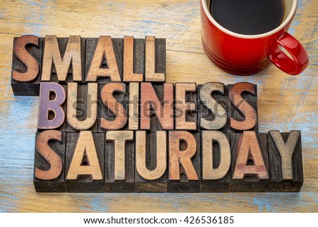 Small Business Saturday word abstract - text in vintage letterpress wood type with a cup of coffee, holiday shopping concept
