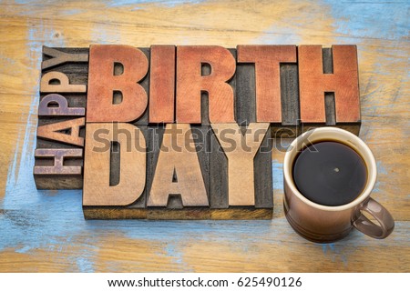 Happy Birthday greeting card - word abstract in vintage letterpress wood type blocks against grunge wooden background with a cup of coffee