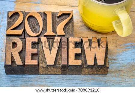 2017 year review banner - text in vintage letterpress wood type block with a cup of coffee