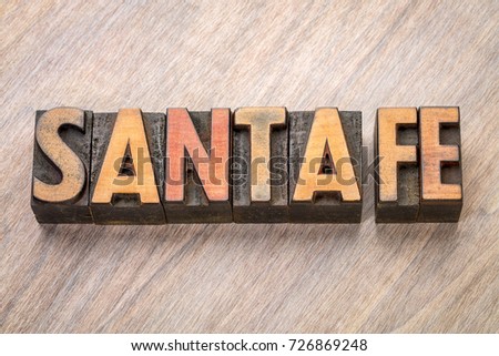 Santa Fe  word abstract in vintage  letterpress wood type against grained wooden background