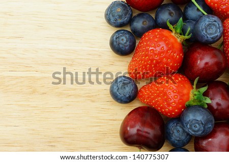 Fruit border on Wooden Background