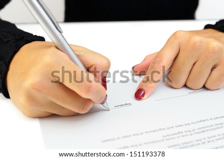 woman is signing contract
