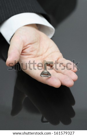 businessman holding the key to success