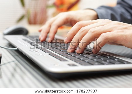 businessman is typing on keyboard
