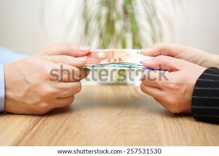 man and woman are fighting over money
