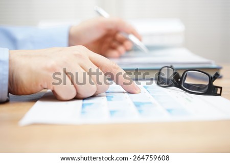 financial consultant is reviewing investment portfolio