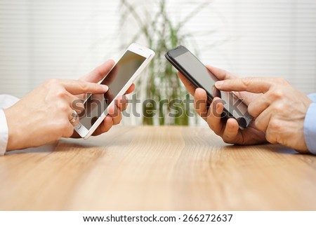 woman and man using applications together on mobile smart phone