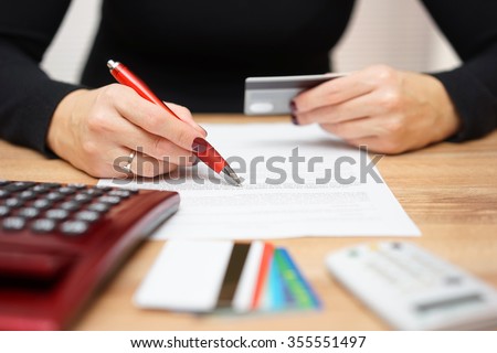 woman is opening bank account and checking  credit card information