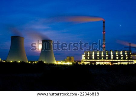 Photo of power plant in the night. Industrial structure landscape