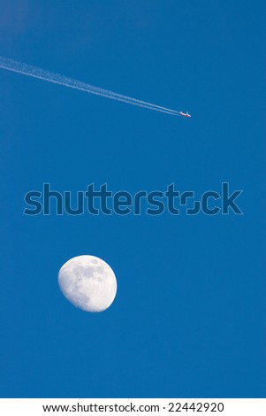 Photo of a jet air plane in the moon and blue sky