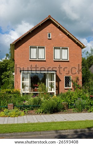Typical family house in Netherlands and sunny day